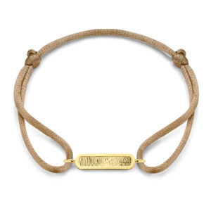 Deze bedel van het merk Minioro is gemaakt van 14 karaats goud en heeft plek waarin een vingerafdruk of gravering kan worden verwerkt. Dit is een elegant en persoonlijk aandenken vol betekenis. Dit kan aan een armband, ketting of ring.